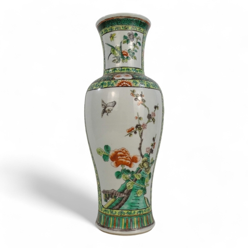 312A - A Chinese famille verte vase - decorated with panels showing exotic birds amongst branches, 35cm hig... 