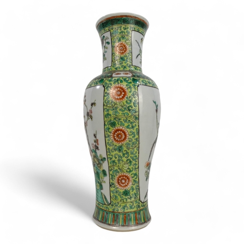 312A - A Chinese famille verte vase - decorated with panels showing exotic birds amongst branches, 35cm hig... 