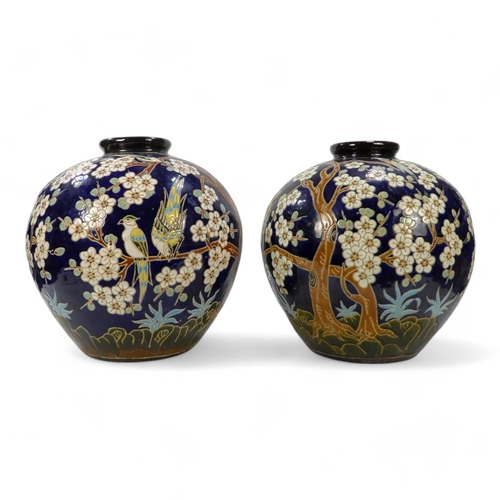 314 - A pair of 20th century Japanese globe shaped vases - decorated with exotic birds and cherry blossom ... 