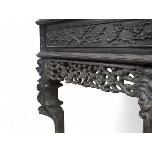 315 - An early 20th century oriental carved hardwood desk - of asymmetrical form incorporating pierced pan... 