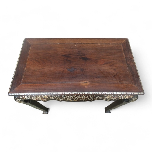 317 - An early 20th century Chinese hardwood side table - the rectangular panel top above a shaped frieze ... 