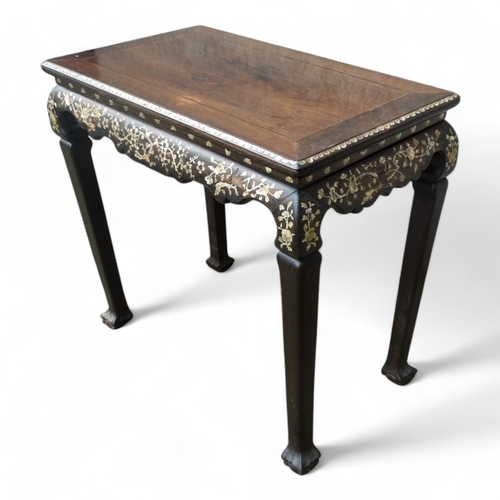 317 - An early 20th century Chinese hardwood side table - the rectangular panel top above a shaped frieze ... 