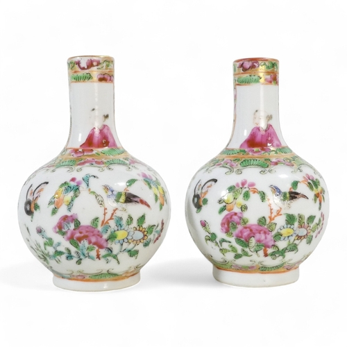 325 - A pair of early 20th century famille verte globe vases - of squat form and decorated with figures in... 