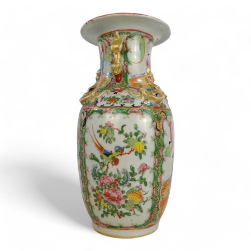 328 - A late 19th century Cantonese vase - decorated with panels of flowers and figures in an interior, mo... 