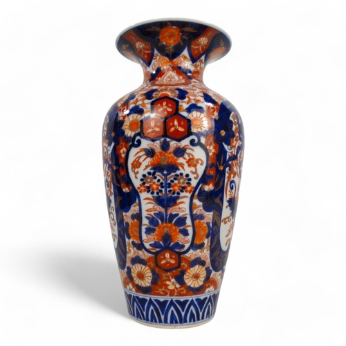 329 - A late 19th/ early 20th century Imari vase - of baluster form and decorated with foliage in a typica... 