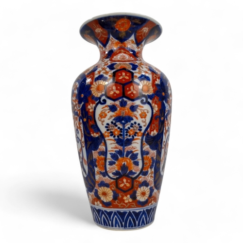 329 - A late 19th/ early 20th century Imari vase - of baluster form and decorated with foliage in a typica... 