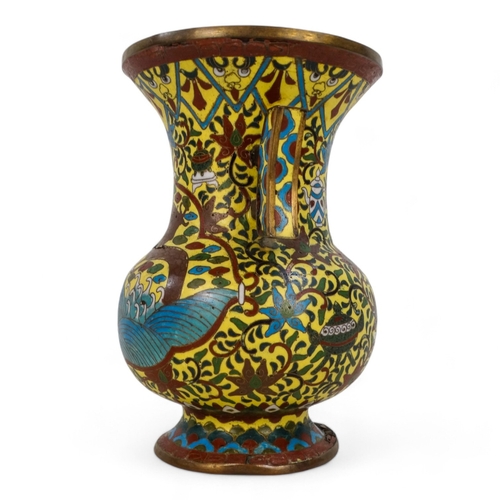 335 - A late 19th century Chinese cloisonne vase - with twin handles, decorated with a dragon, flowers and... 