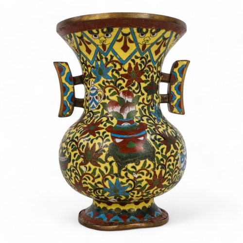 335 - A late 19th century Chinese cloisonne vase - with twin handles, decorated with a dragon, flowers and... 