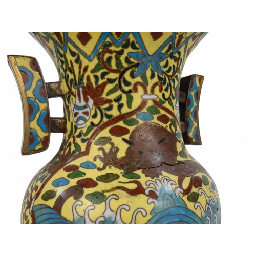 335 - A late 19th century Chinese cloisonne vase - with twin handles, decorated with a dragon, flowers and... 