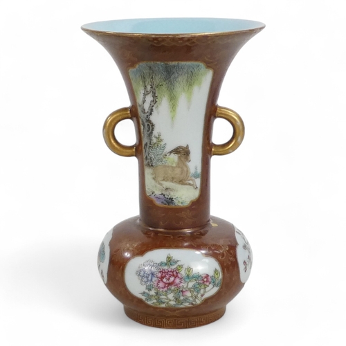 340 - An early 20th century Chinese bottle vase - with flared neck and twin handles, incorporating famille... 