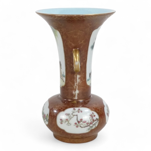 340 - An early 20th century Chinese bottle vase - with flared neck and twin handles, incorporating famille... 