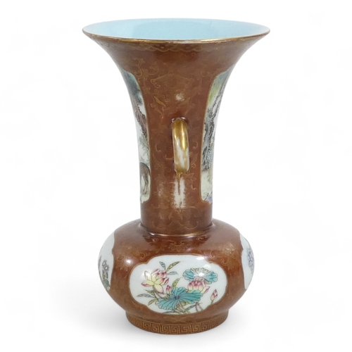 340 - An early 20th century Chinese bottle vase - with flared neck and twin handles, incorporating famille... 