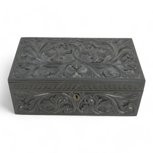 35 - A late 19th century Anglo Indian box - of rectangular form, leaf carved and elephant inlay to interi... 