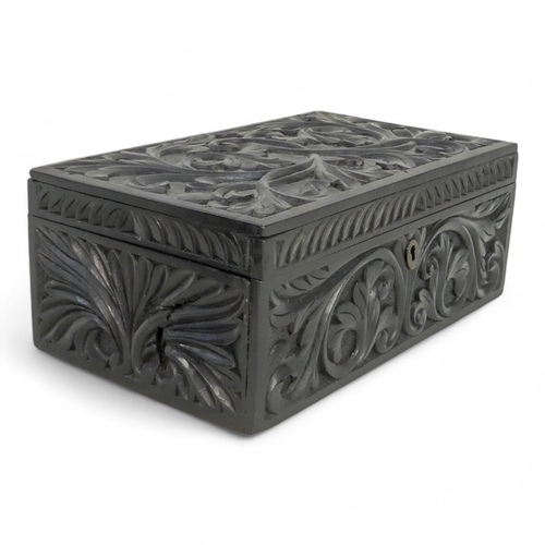 35 - A late 19th century Anglo Indian box - of rectangular form, leaf carved and elephant inlay to interi... 