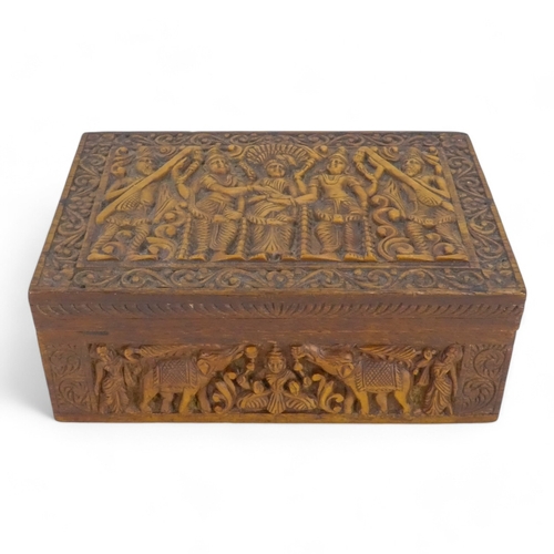 35 - A late 19th century Anglo Indian box - of rectangular form, leaf carved and elephant inlay to interi... 