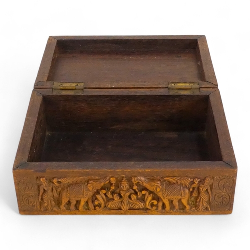 35 - A late 19th century Anglo Indian box - of rectangular form, leaf carved and elephant inlay to interi... 