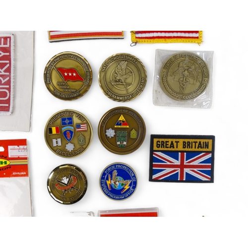 364 - A quantity of medallions - together with cloth badges and other memorabilia.