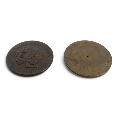 371 - A single faced 1909 one penny coin - together with a Spanish 1877 ten centimos coin inscribed '33' t... 