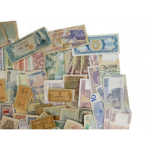 377 - A quantity of British and foreign banknotes - to include Scotland, Guernsey, Hong Kong, Spain, Franc... 