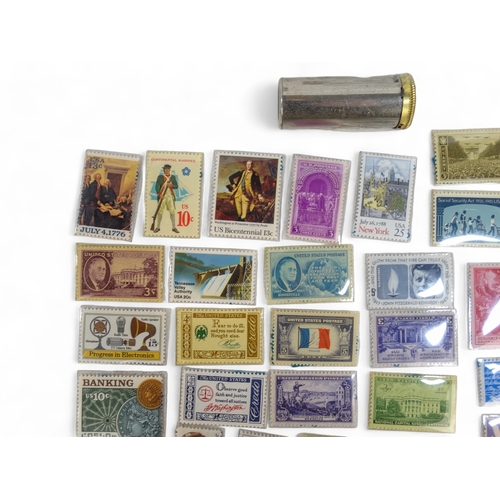 386 - A small quantity of American stamps 1932-1985 - together with a Magic Pocket Savings Bank.