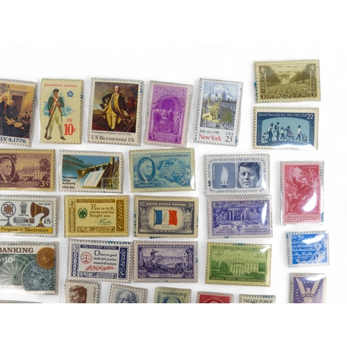 386 - A small quantity of American stamps 1932-1985 - together with a Magic Pocket Savings Bank.