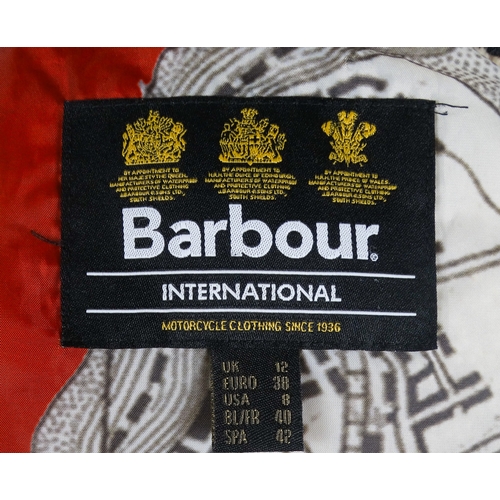 391 - A Barbour black quilted jacket - with printed map lining, size 12, length 62cm.