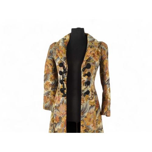 396 - A Biba ladies maxi coat - decorated in a broad floral brocade and arrangement of four black bullion ... 