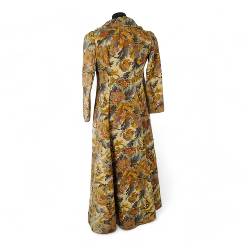 396 - A Biba ladies maxi coat - decorated in a broad floral brocade and arrangement of four black bullion ... 