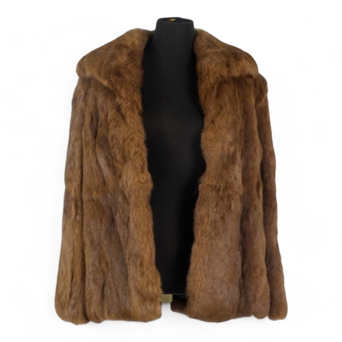 398 - A Jacques Saint Laurent brown fur jacket - size 10/12, length 70cm.