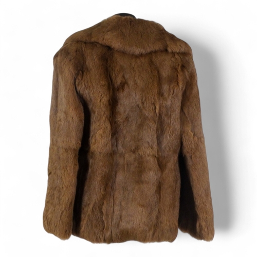 398 - A Jacques Saint Laurent brown fur jacket - size 10/12, length 70cm.