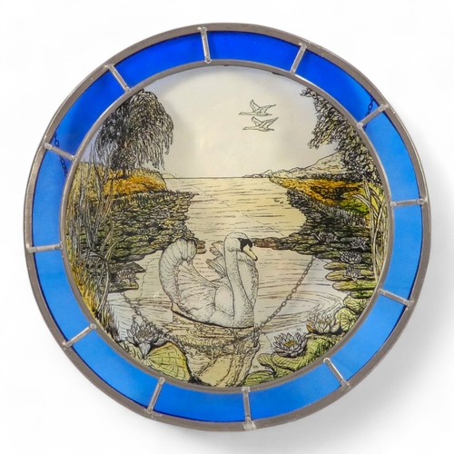 4 - A pair of circular stained glass panels - decorated with wildlife scenes within a coloured glass ban... 