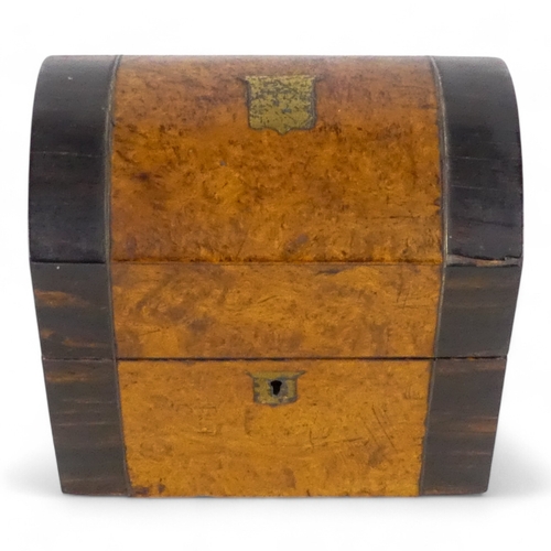 40 - An early Victorian amboyna and coromandel bottle casket - with a domed cover and two division interi... 