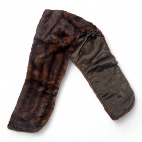 400 - A short brown fur cape - together with two fur stoles and two other fur pieces.