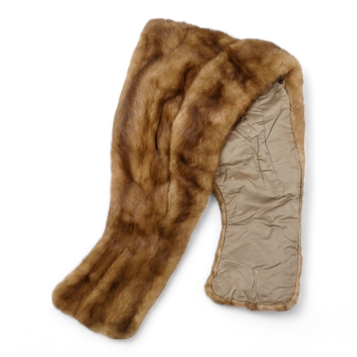 400 - A short brown fur cape - together with two fur stoles and two other fur pieces.