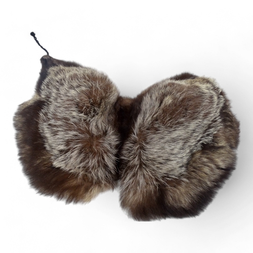 400 - A short brown fur cape - together with two fur stoles and two other fur pieces.