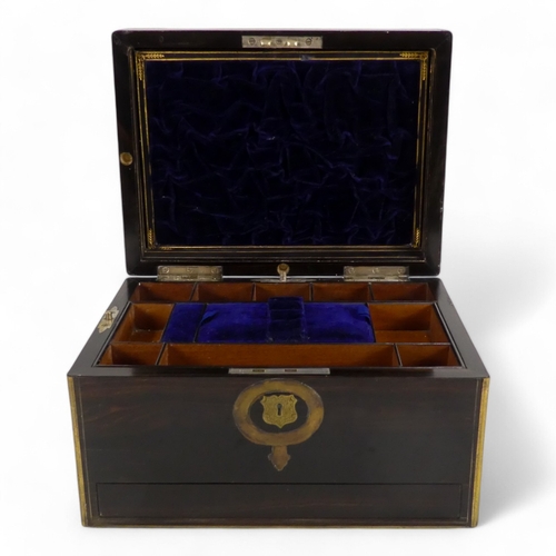 42 - A Victorian coromandel and brass bound dressing case - the hinged lid with brass garter inlay, the f... 