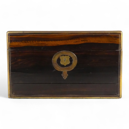 42 - A Victorian coromandel and brass bound dressing case - the hinged lid with brass garter inlay, the f... 