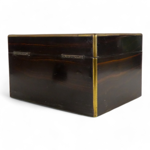 42 - A Victorian coromandel and brass bound dressing case - the hinged lid with brass garter inlay, the f... 