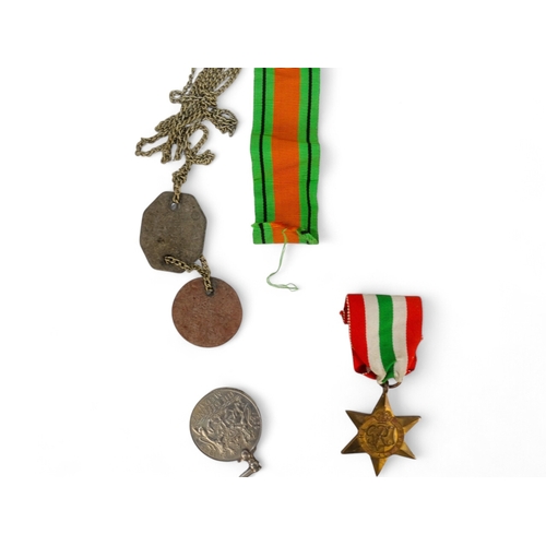 438 - A group of five WWII medals - together with two dog tags to D.Domsell, contained within original box... 