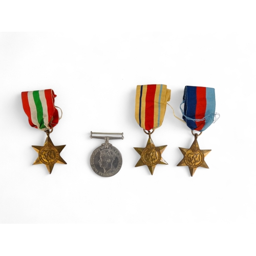 438 - A group of five WWII medals - together with two dog tags to D.Domsell, contained within original box... 