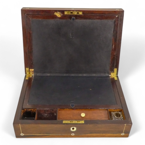 44 - A George IV rosewood and mother-of-pearl inlay writing slope - the fitted interior with inkwell and ... 