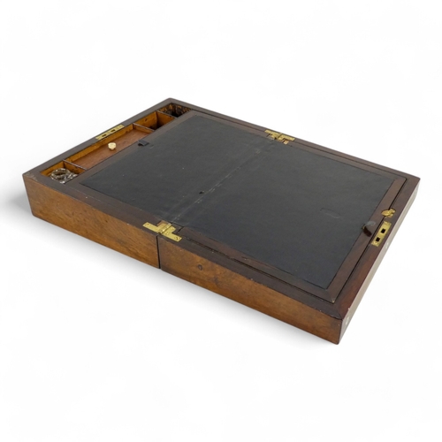 44 - A George IV rosewood and mother-of-pearl inlay writing slope - the fitted interior with inkwell and ... 