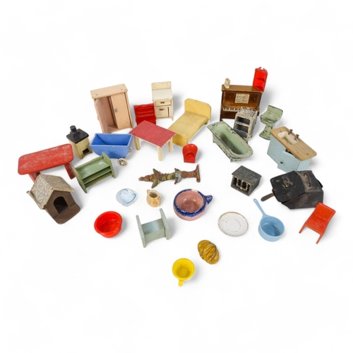 473A - A quantity of mid 20th century dolls house furniture - including a die cast bath, sink and gas oven,... 