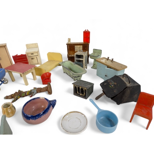 473A - A quantity of mid 20th century dolls house furniture - including a die cast bath, sink and gas oven,... 