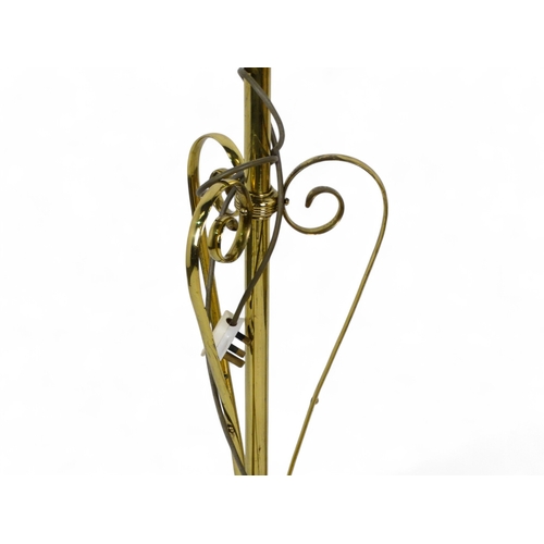 49 - A late Victorian brass adjustable standard lamp - with tripod base with Art Nouveau style supports, ... 