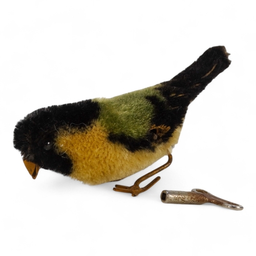 514 - A Schuco pecking bird - mohair covered as a great tit, 12cm wide.