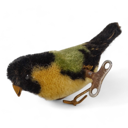 514 - A Schuco pecking bird - mohair covered as a great tit, 12cm wide.