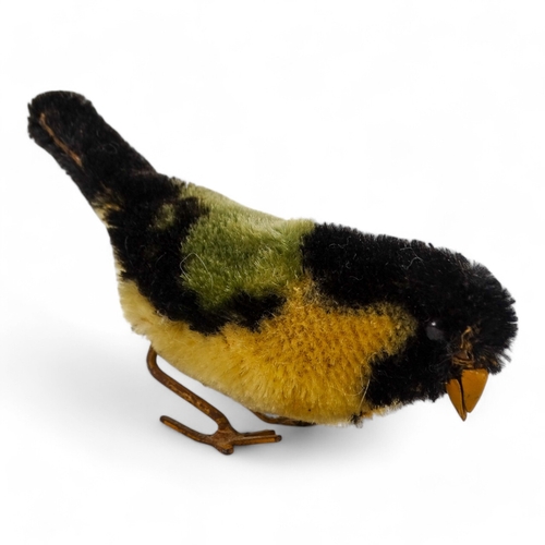 514 - A Schuco pecking bird - mohair covered as a great tit, 12cm wide.