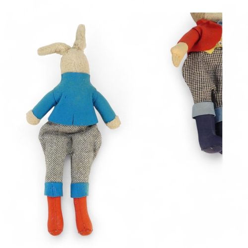 514A - A mid 20th century toy monkey - with felt clothing, height 42cm, together with a similar rabbit.