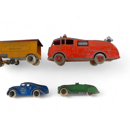 516 - A small quantity of Dinky vehicles - including a Foden flat-bed truck, Ferrari racer and a fire engi... 